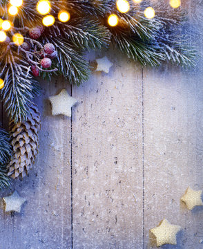 art Christmas background with fir twigs and golden stars