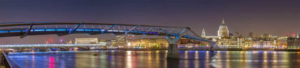 Panoramic shot of St Paul's Cathedral and the Millennium Bridge by night, London, UK