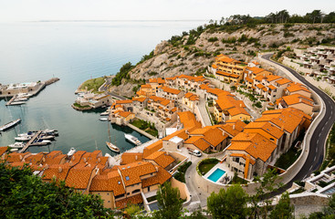 little italian marina with sailing and motor boats