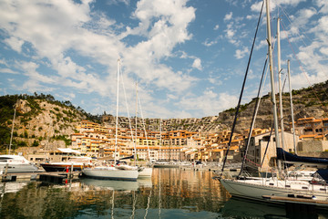 little italian marina with sailing and motor boats