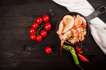 Fried shrimp on a wooden background. Top view