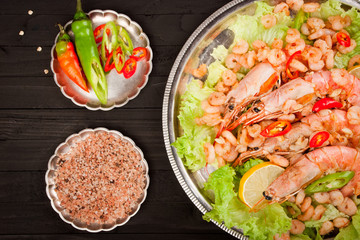 Fried shrimp on a wooden background. Top view