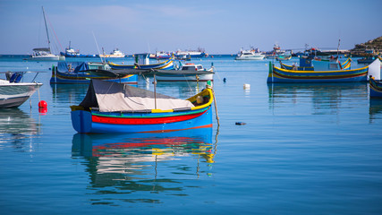 Fototapeta na wymiar Typical colorful fishing boats of Masaxlokk, Malta