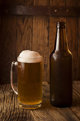 Beer barrel with  glass on table  wooden background