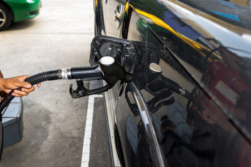 Fototapeta premium Fuel nozzle pay for fuel and benzyl.
