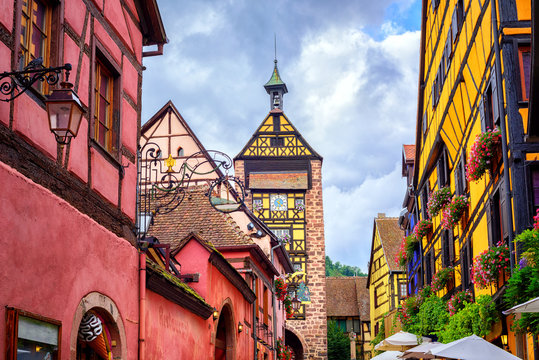 Colorful houses on a central street in Riquewihr, village on win