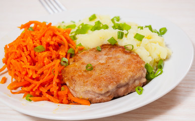 burger with mashed potato and carrot salad