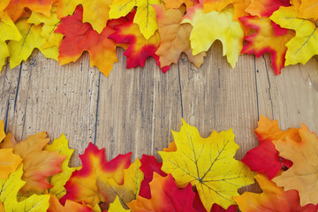 Naklejka na ściany i meble Autumn Leaves and Weather Wood Background