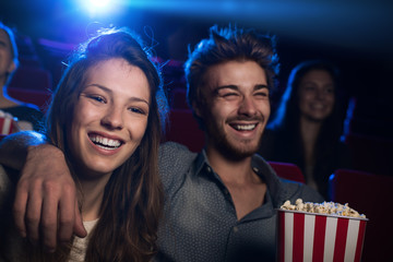 Happy couple in the movie theater