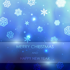 Fototapeta na wymiar New year blue blurred background with snowflakes with text Marry Christmas And Happy New Year