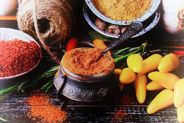 set spice pepper garlic bay leaf barberry turmeric dark wood background retro style