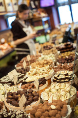 Chokolates and pralines in candy shop