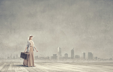 Woman with old suitcase