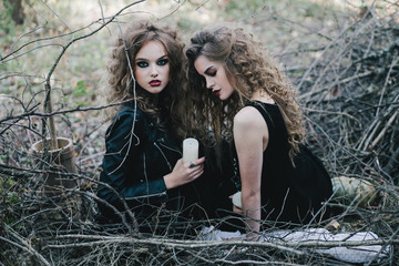 Two vintage witches gathered eve of Halloween