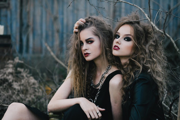 Two vintage witches gathered eve of Halloween