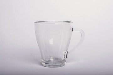 Empty glass tea cup. Isolated on white background