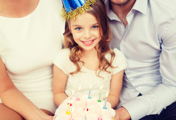 family with cake and candles