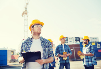 group of builders in hardhats outdoors
