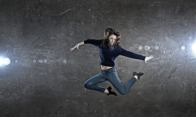 Fototapeta na wymiar Dancer girl in jump