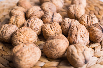 walnuts on a wicker background