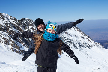 Happy kids on the top of mountain