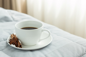 coffee cup in the morning on the bed background