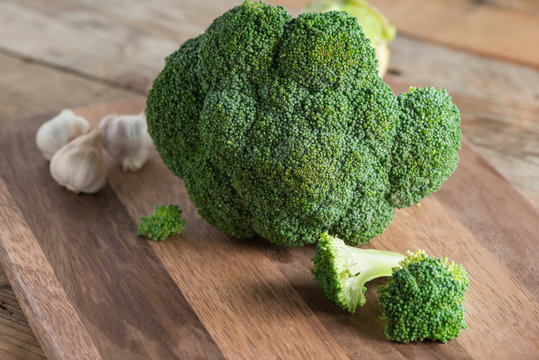 Broccoli on wood board. Selective focus.