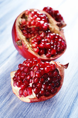 Fresh ripe garnet on wooden table close up