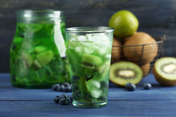 Kiwi and Blueberry cocktail on wooden background