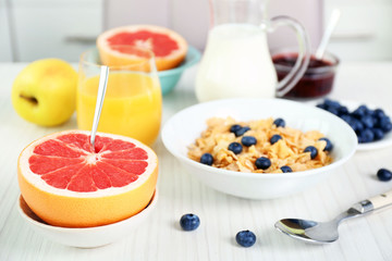 Healthy breakfast with fruits and berries on table close up