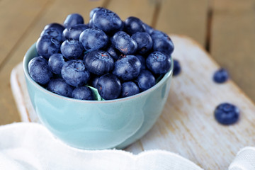 Fresh blueberries in bowl on table close up