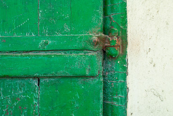 chipped paint on the door of the old boards texture background