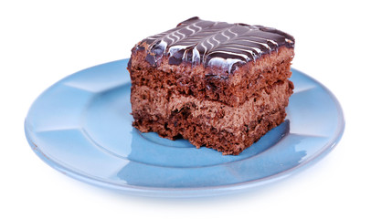Sweet chocolate cake on blue plate isolated on white background