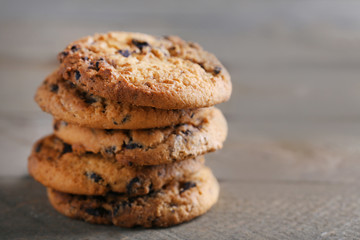 Cookies with chocolate crumbs on wooden table, close up