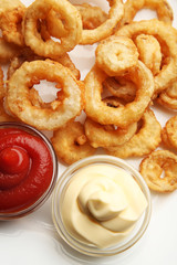 Obraz na płótnie Canvas Chips rings with sauce on plate