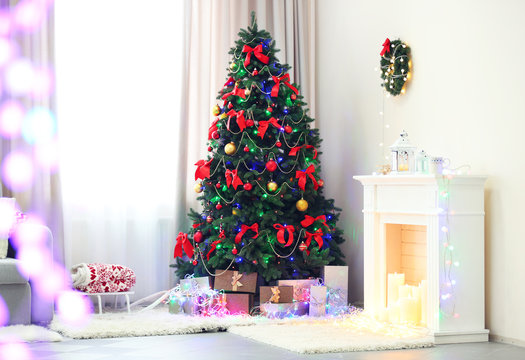 Perfect Christmas tree with gifts underneath in living room
