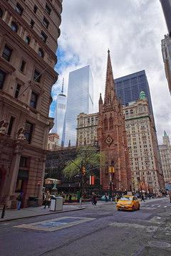 Trinity Church At The Intersection Of Wall Street And Broadway