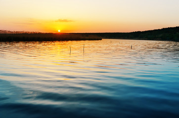 Fototapeta na wymiar blue river and sunset