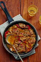 Lamb stew in a frying pan, top view