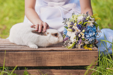 rabbit sniffs bouquet