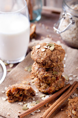 Oat and peanut butter cookies with pumpkin seeds,cinnamon,milk.