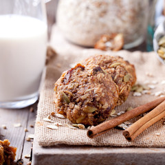 Oat and peanut butter cookies with pumpkin seeds,cinnamon,milk.