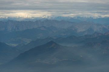 Fototapeta na wymiar Dull Austrian Alps from an Airplane