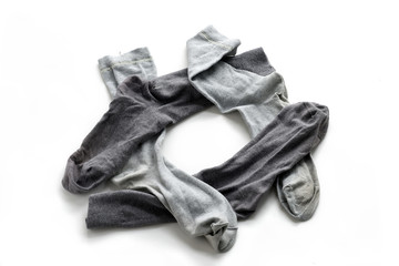 Clean laundered men's socks on a white background