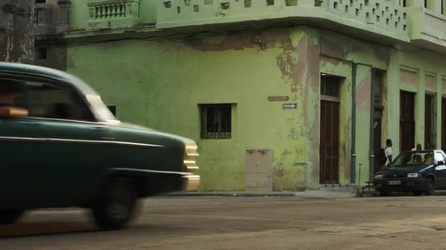 Old Havana street with cars and people