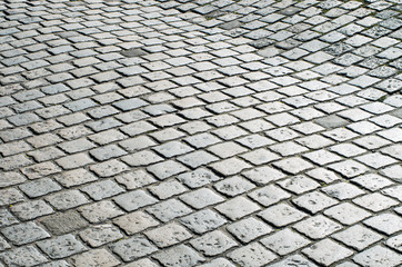 Old road paved with granite stones