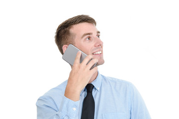 Businessman in blue shirt talking with phone on white.