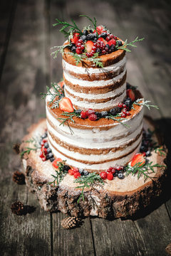wedding cake in rustic style with berries