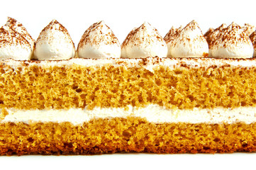 Honey cake with cream on a white background