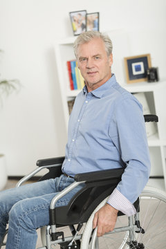 Portrait of disabled man on wheelchair